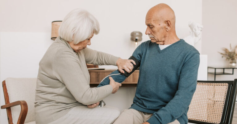 seniors measure blood pressure at home