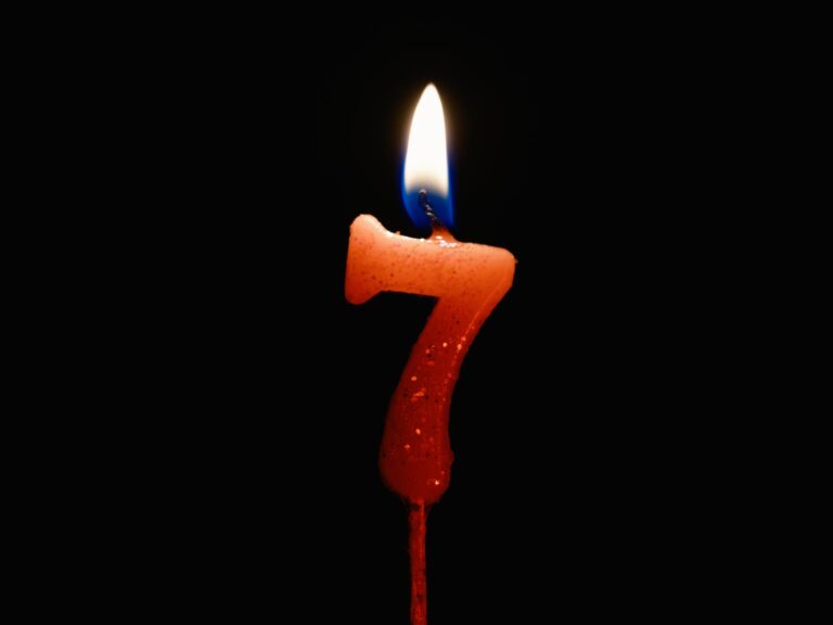 photograph of a lit seven candle